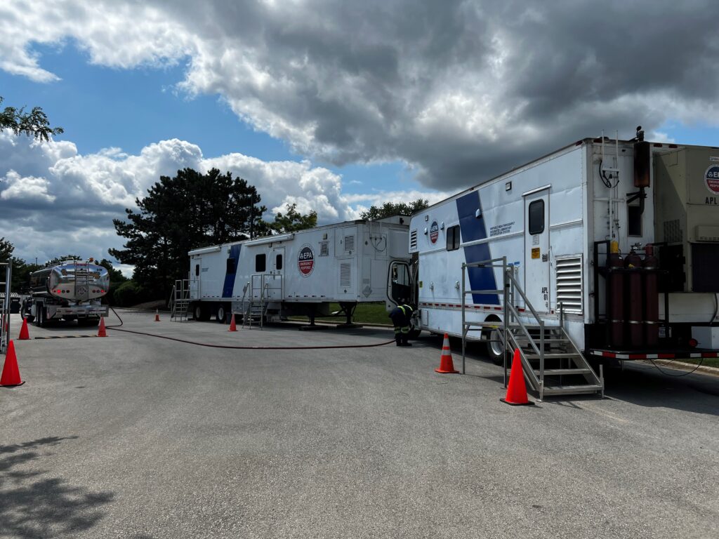 tractor trailers stationed in a parking lot